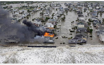 Photo of a house burning on Galveston Island, Texas, as Hurricane Ike hits the Gulf Coast in 2008.