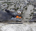 Photo of a house burning on Galveston Island, Texas, as Hurricane Ike hits the Gulf Coast in 2008.