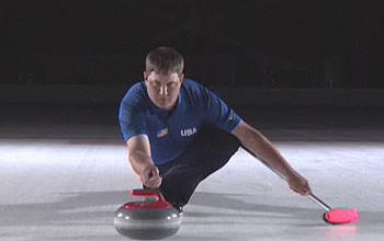 Olympic medalist John Shuster demonstrates curling with the rock