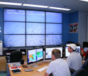 Photo of oceanographers watching the live video feed onshore at Rutgers University.