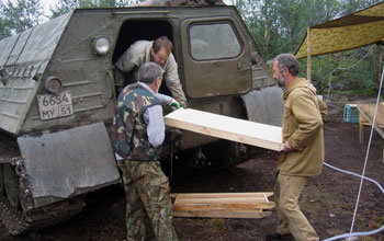 Photo of drill cores being loaded into a truck.