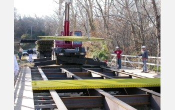 A small crane can lift and position the enormous fiberglass-polymer composite plates