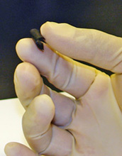 Photo of hand holding new nanocomposite paper