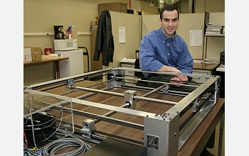 scientist with robotic system