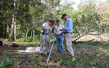 Researchers take soil cores from reservoir near ancient Maya city of Tikal