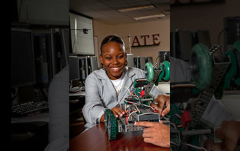 A student terminates connections for a VEX robot project prior to program testing