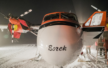 The Kenn Borek Air Ltd. Twin Otter airplane rests on airstrip at Amundsen-Scott South Pole Station