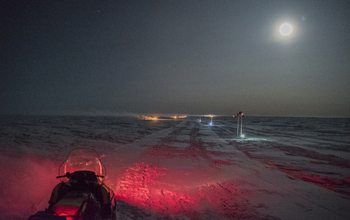 Skiway at Amundsen-Scott South Pole Station lit with electric lights and burning 