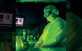 A technician operates an ultra-high-intensity laser system
