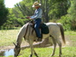 A citizen scientist on horseback collects data along the San Pedro River in Arizona.