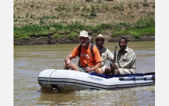 Frank Brown crossing the Omo River accompanied by Tamrat Haile Mariam and Zmaneh Shugut.