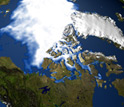 Satellite image from north pole showing Arctic sea-ice, ice covered Greenland, and adjacent areas.