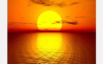 Photo showing the sun and the ocean.