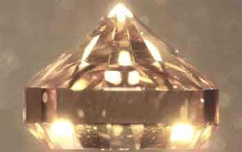 Photo of a synthetic brilliant cut single-crystal diamond grown by chemical vapor deposition, CVD.