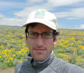 Biologist Peter Adler at a field research site.