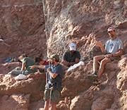 The field team excavates the first major quarry platform on the cliff where the fossil was found.