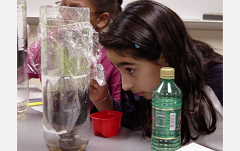 Photo of girl performing a science experiment.