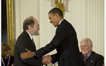 Photo of James Gunn receiving the National Medal of Science from President Barack Obama.