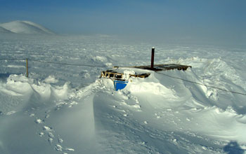 Photo of snow and ice covering a building at Lake E in the Russian Arctic.