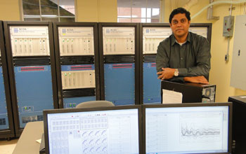 G. Kumar Venayagamoorthy in his lab, surrounded by computers