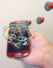 Illustration showing a smartphone and 3-d representations of the AIDS virus.
