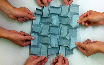 Hands unfolding origami design