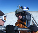 a scientist field-testing new instrumentation to accurately measure snow.