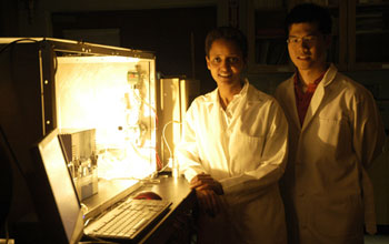 Photo of Sossina Haile and William Chueh next to the benchtop thermochemical reactor.