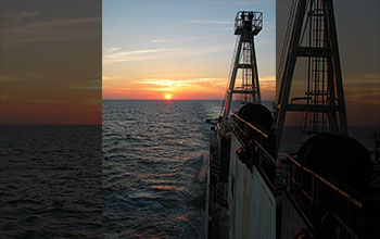 View from stern of the <em>JOIDES Resolution</em> at sunset