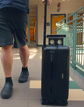 a smart suitcase that warns blind users of impending collisions