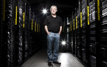 Man standing in front of large computers