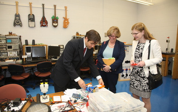 Gavin Garner showing equipment at UVa's lab to NSF's Joan Ferrini-Mundy and Susan Singer.