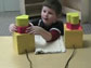 a young boy with blocks as part of an experiment at the University of Texas at Austin.