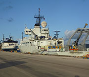 The research vessels Thompson and Langseth in port at the Guam Naval Base before the cruise began.