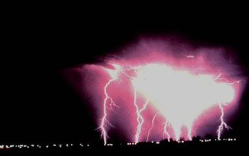 Photo of lightning and a violent thunderstorm.