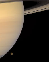 A photo of a natural color view of Saturn and Titan.