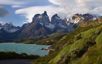 Green mountain range and blue lake