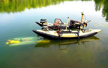 a yellow underwater robot (left)
