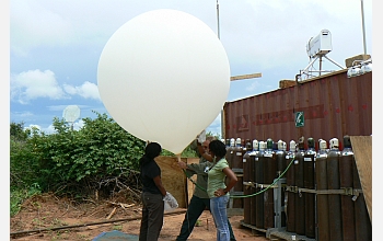 Scientists and graduate students launch a weather balloon from Kawsara, Senegal.