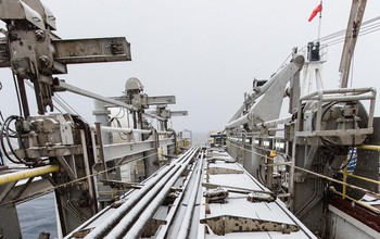 Snow-covered drilling equipment on a previous ocean drilling expedition to the Antarctic’s Ross Sea.