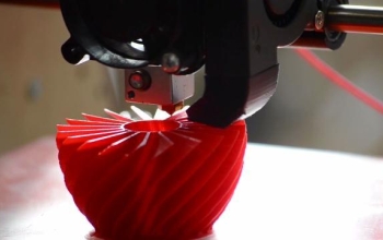 close up of 3d printer printing an object