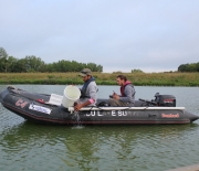 Researchers sample a lake in Iowa for the state's water quality monitoring program.