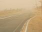 Dust storm over rural road