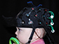 a baby wearing a cap with sensors