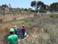 students & workers inspect a large-scale biofilter