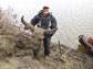 Daniel Mann holds a steppe bison skull