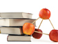 a stack of books and apples