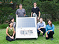 Rice University researchers with a scaled up test bed of the NEWT Center's direct solar desalination system
