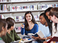 a group of teenage students discussing books