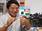 Huikai Xie displays a micro-endoscope